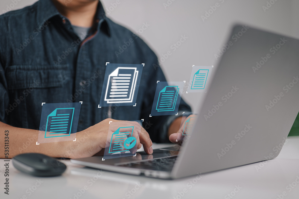 Aufkleber concept of a businessman using a laptop computer with a document management icon as part of a data s