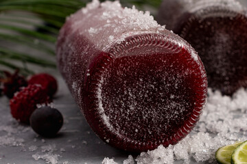 Glass bottle with natural blackberry juice with lemon