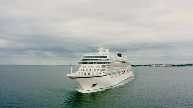 The cruise liner sails in the Baltic Sea, the ship leaves the harbor of Gdansk Poland. Water transport. aerial view of the stern of a cruise ship leaving the cruise terminal 
