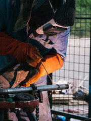 Iron soldering, Man working on iron soldering, welding sparks