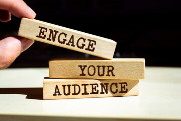 Wooden blocks with words 'Engage Your Audience'.