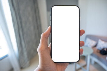 Close up men using a smartphone with an empty white screen at home.