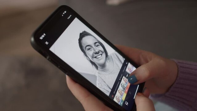 Insecure girl editing her selfies on Instagram, Closeup