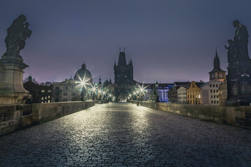 Charles bridge illuminated at dawn, Medieval Prague, Czech Republic