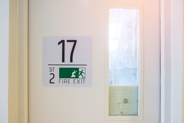 Fire Exit door sign for emergency. Stairwell fire for escape in building or apartment