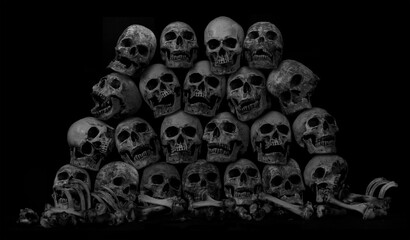 Awesome pile of skull human and bone on black cloth background, concept of scary crime scene of horror or thriller movies,Halloween theme, Still Life style, selective focus,