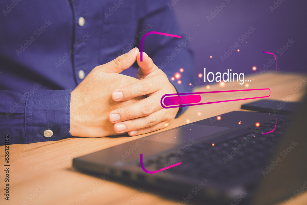 Poster Man using laptop for download software and waiting to loading digital business data form website, concept of waiting for load of loading bar.