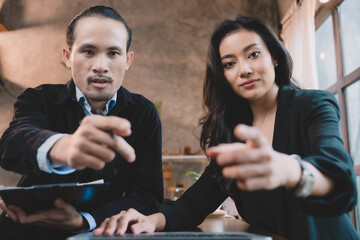 Two businessperson enjoyed meeting on the project. two partner discussing business planning with technology.