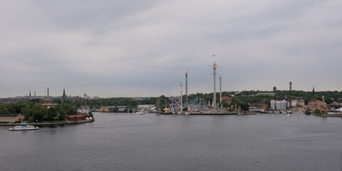 Naklejka premium Stockholm, Sweden – June, 2022 – View of Gröna Lund (Green Grove), or colloquially Grönan, an amusement park of the city from Fjällgatan viewpoint, located in the borough of Södermalmn. 