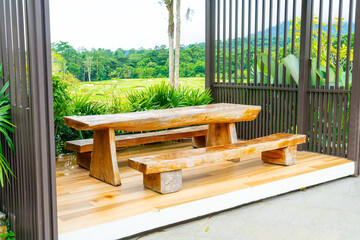 outdoor patio deck and chair with mountain hill background