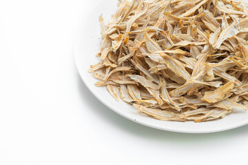 dried small crispy fish on white background