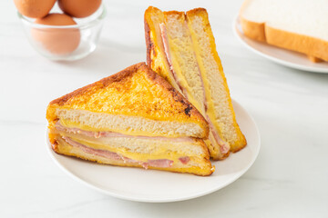 sandwich ham cheese on white plate