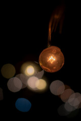 String lightbulb with blurry bokeh
