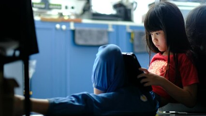 chinese child addicted phone, asian girl playing smartphone, kid watching cartoon
