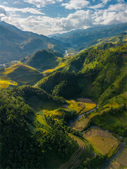 Aerial view of golden rice terraces at Mu cang chai town near Sapa city, north of Vietnam. Beautiful terraced rice field in harvest season in Yen Bai, Vietnam