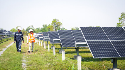 Engineers take investors on a tour of solar power plants. solar panels are an alternative electricity source to be sustainable resources in the future. The clean energy concept saves the world