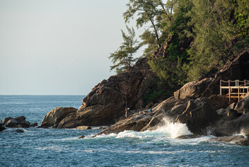 phuket waves crashing on rocks