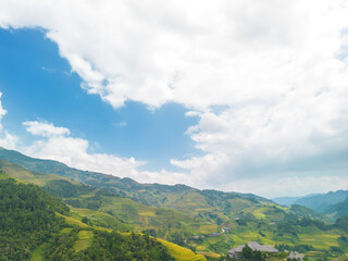 Aerial view of golden rice terraces at Mu cang chai town near Sapa city, north of Vietnam. Beautiful terraced rice field in harvest season in Yen Bai, Vietnam