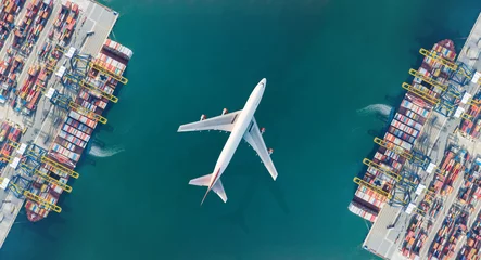 Foto op Canvas Aerial top view of Container ship loading and unloading, Cargo container in deep seaport for the international order. Transportation and travel concept. © AU USAnakul+