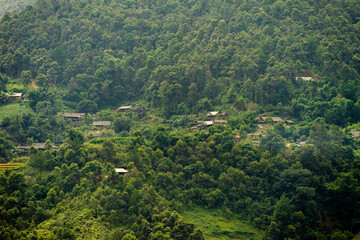 Obraz premium Aerial view of golden rice terraces at Mu cang chai town near Sapa city, north of Vietnam. Beautiful terraced rice field in harvest season in Yen Bai, Vietnam