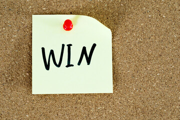 Win post note on cork board