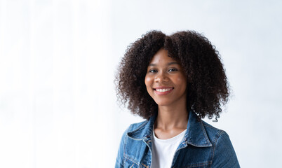 Portrait of beautiful positive african american woman standing with arms crossed