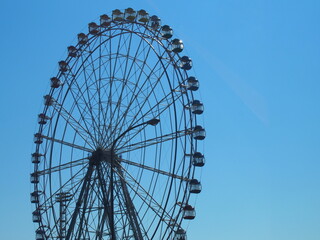 ferris wheel on a blue sky