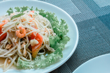 The image of Papaya Salad with Blue Crab is beautifully placed on the dining table in restaurants, seafood, food and tourism.