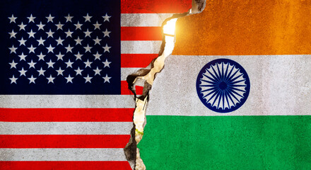 American and Indian flags on broken cracked wall
