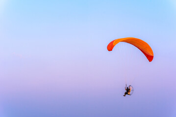 Paramotor flying on the sky