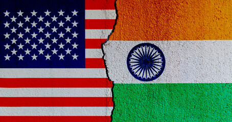 American and Indian flags on broken cracked wall