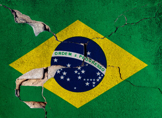 Brazilian flag on cracked concrete wall
