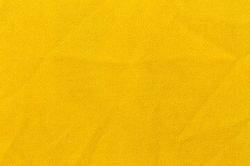 Yellow color sports clothing fabric football shirt jersey texture and textile background.