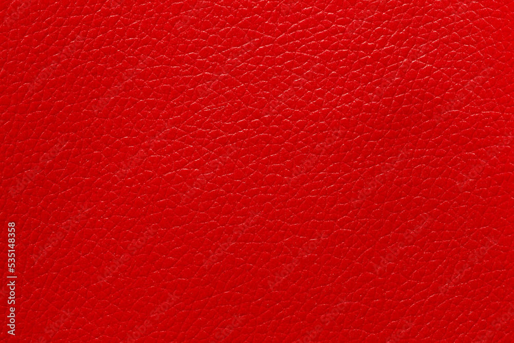 Wall mural Close-up of a red leather and a textured background.