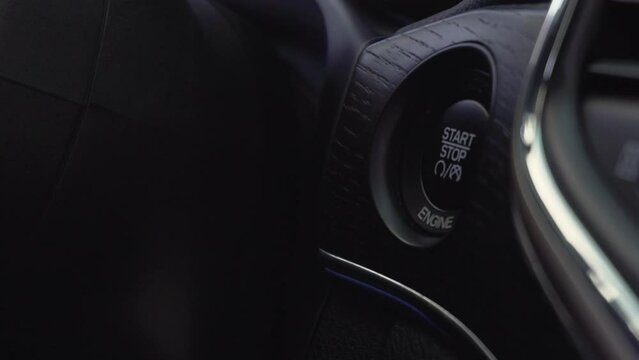 Engine start stop button from a modern car interior
