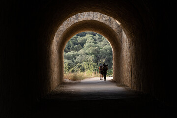 Community of Navarra, Spain; September 07, 2022; Tunnel and walkers on the French Way of Saint James.