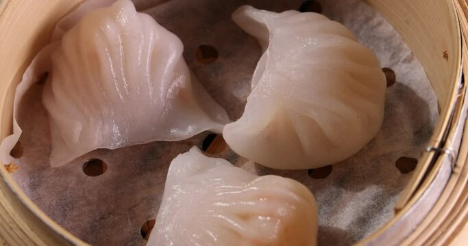 crystal har gow transparent prawn shrimp chicken meat stuffed dim sum in bamboo steamer rotate 