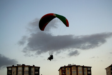 Obraz premium paragliding in the sky, paraglider in the sky, silhouette of paraglider