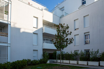 square white building residential apartment balcony