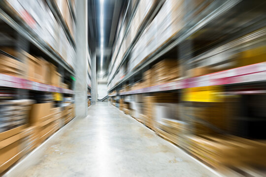Motion blur effect of large warehouse with big boxes