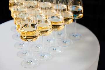 Set of glasses with white wine on a buffet table