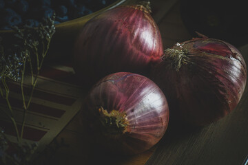 Raw red onions dark food photo style