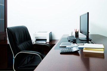 Modern workspace with computer and chair