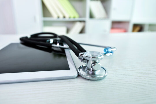 Stethoscope and digital tablet on doctor desk
