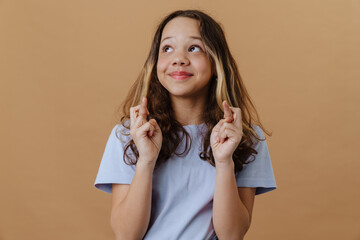 White preteen girl wearing t-shirt smiling and looking at camera