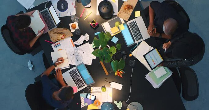 Planning, strategy and teamwork in office with top view late at night and business people in digital agency, marketing or meeting. Motivation, vision or brainstorming with employees for goal or idea