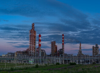 overview of metal pipes of an oil refinery outdoors