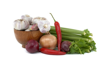 Onions, chili pepper and garlic bulbs in wooden bowl