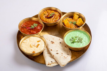 Indian Veg Thali / food platter, selective focus isolated on white background