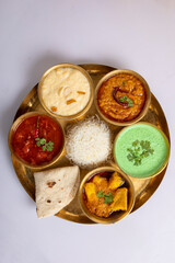 Indian Hindu Veg Thali / food platter, selective focus isolated on white background